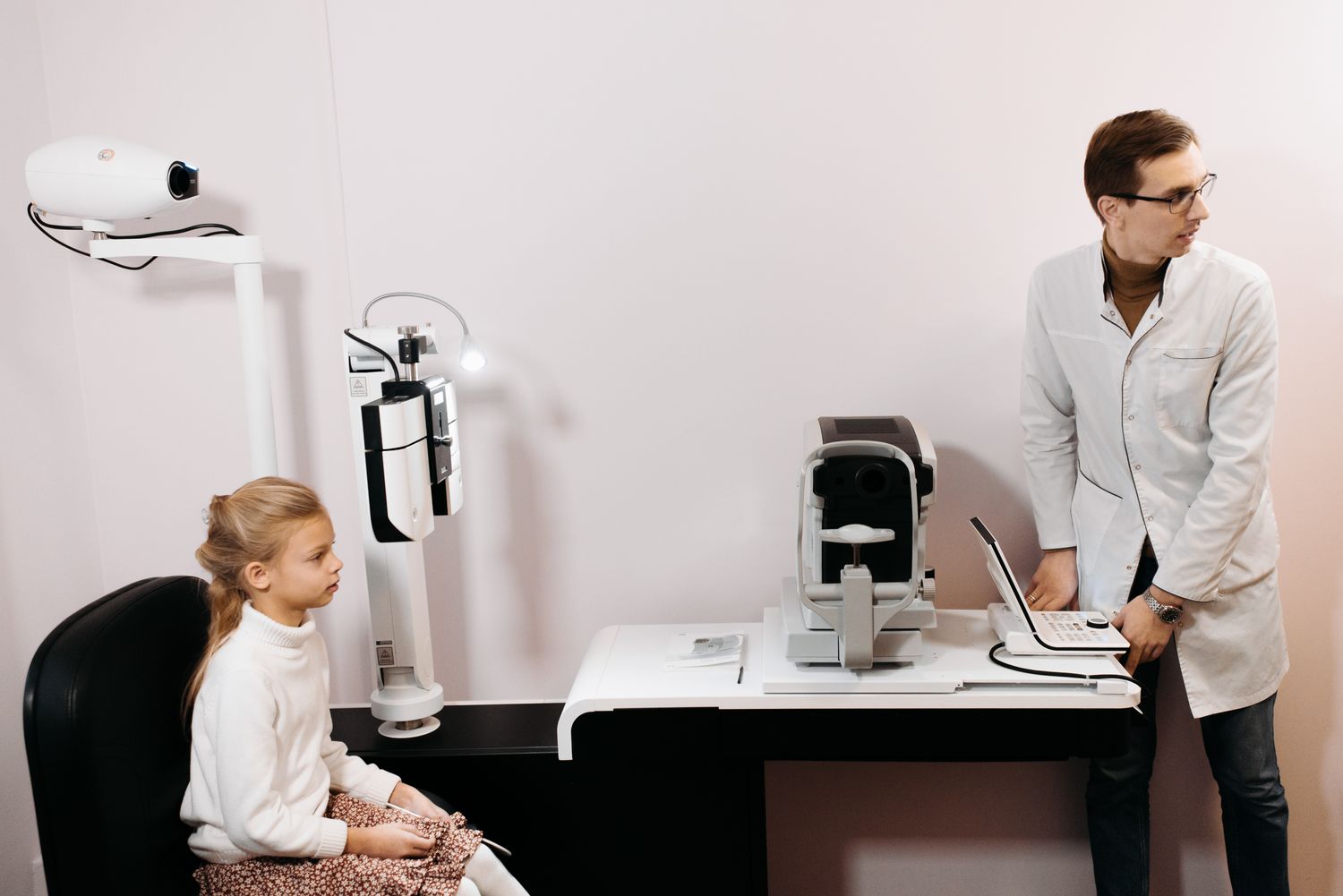 Child having a comprehensive eye examination with modern diagnostic equipment